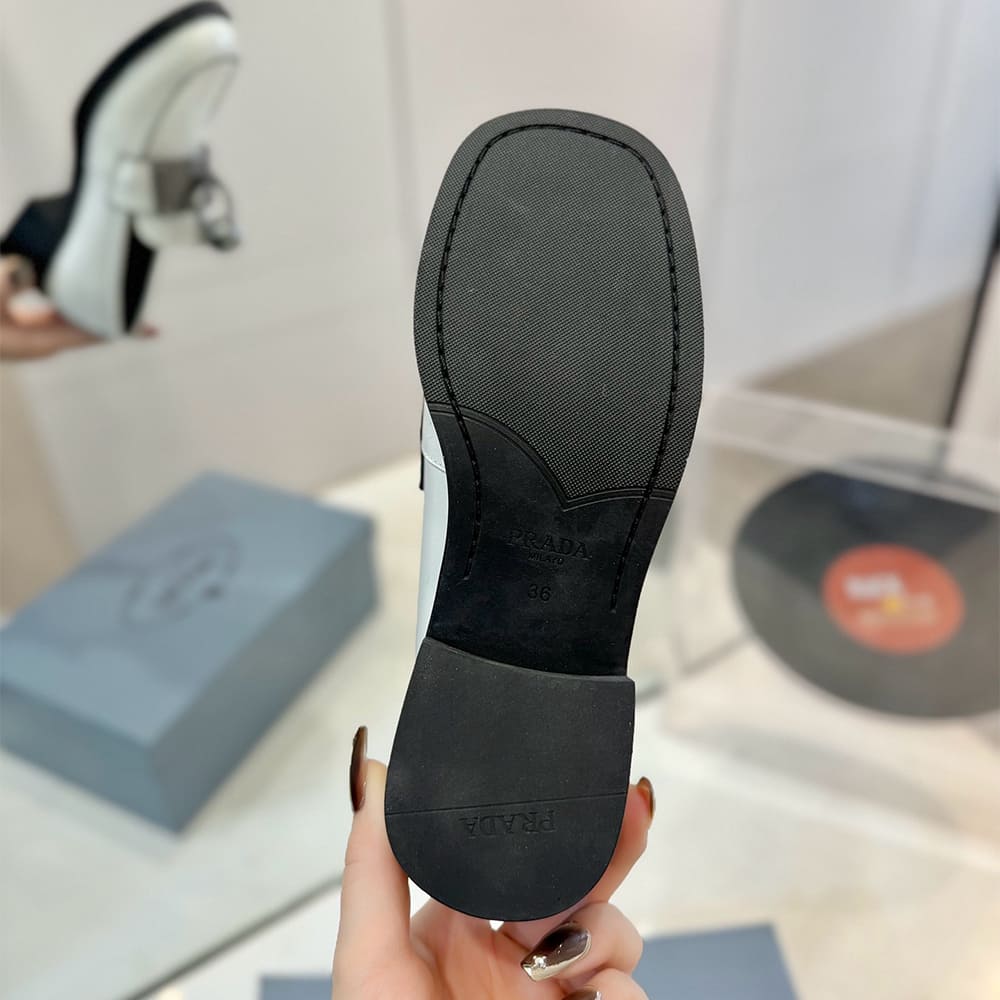 Pra*a Brushed leather loafers with metal details
